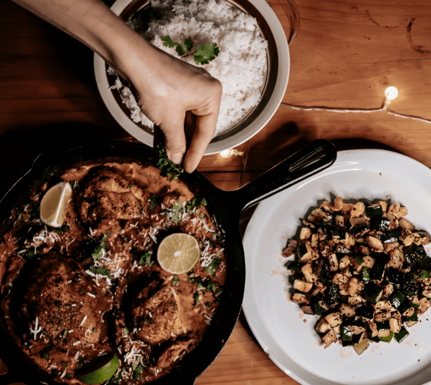 Farm-to-table food spread with hands reaching in
